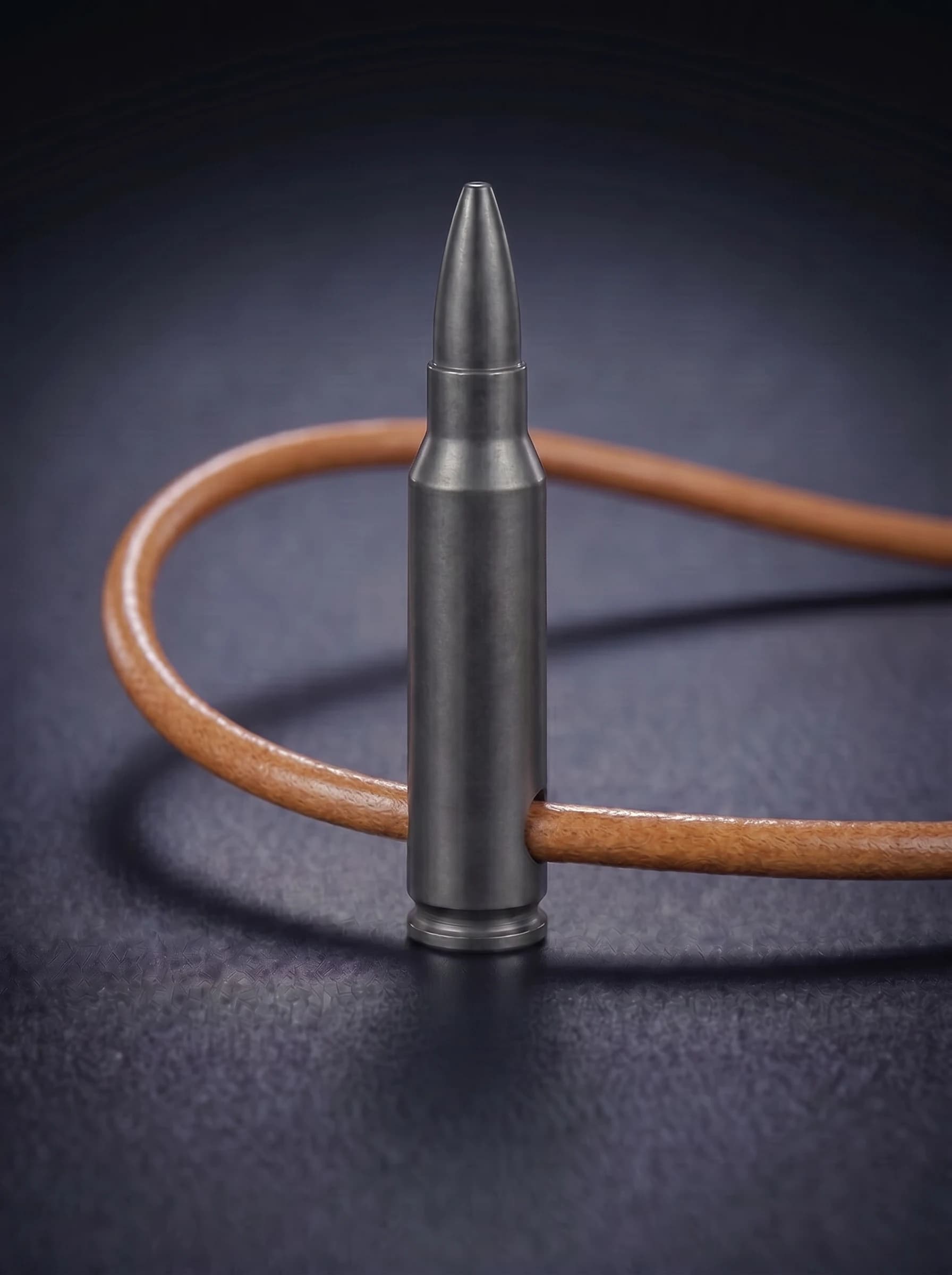 Rifle Cartridge in black on original leather cord, view 1