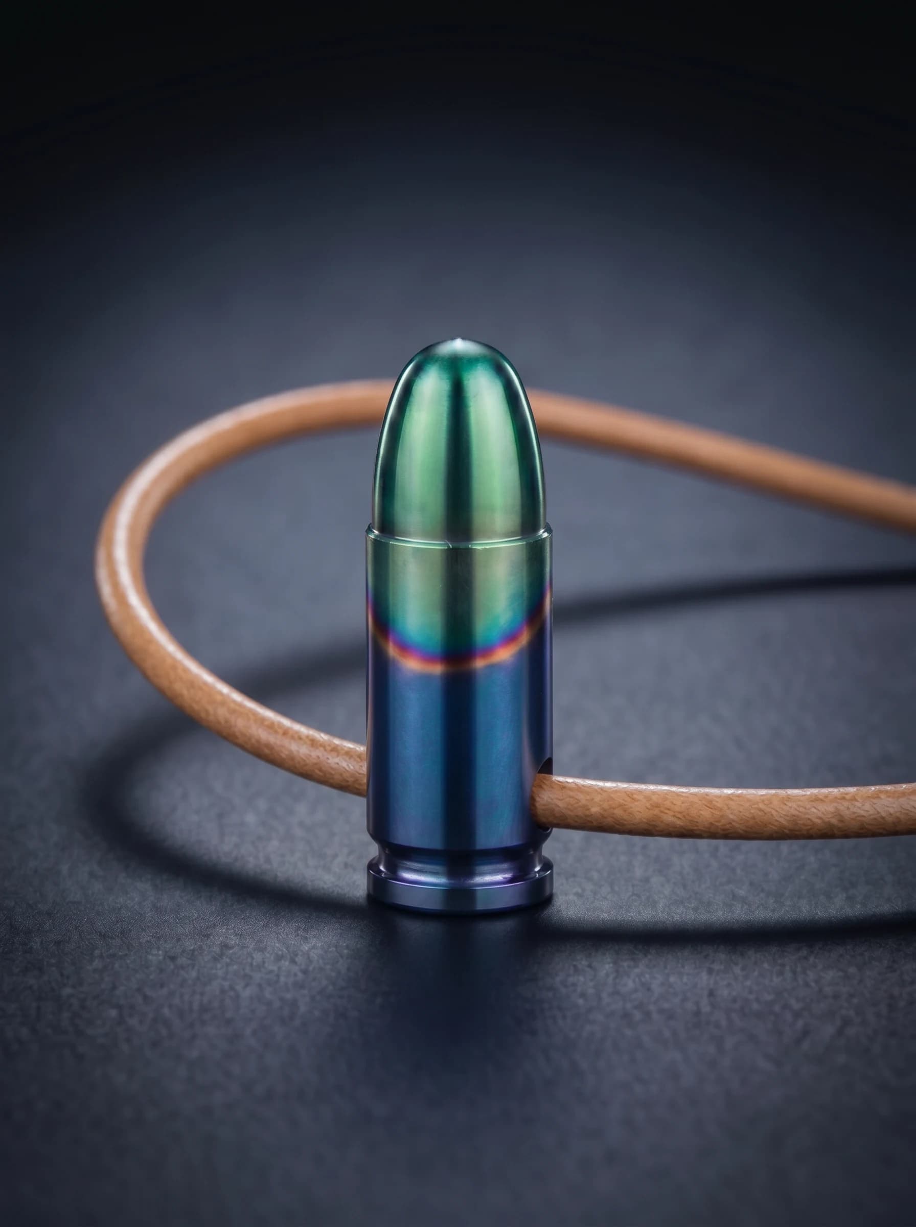 Pistol Cartridge in multishade on original leather cord, view 1