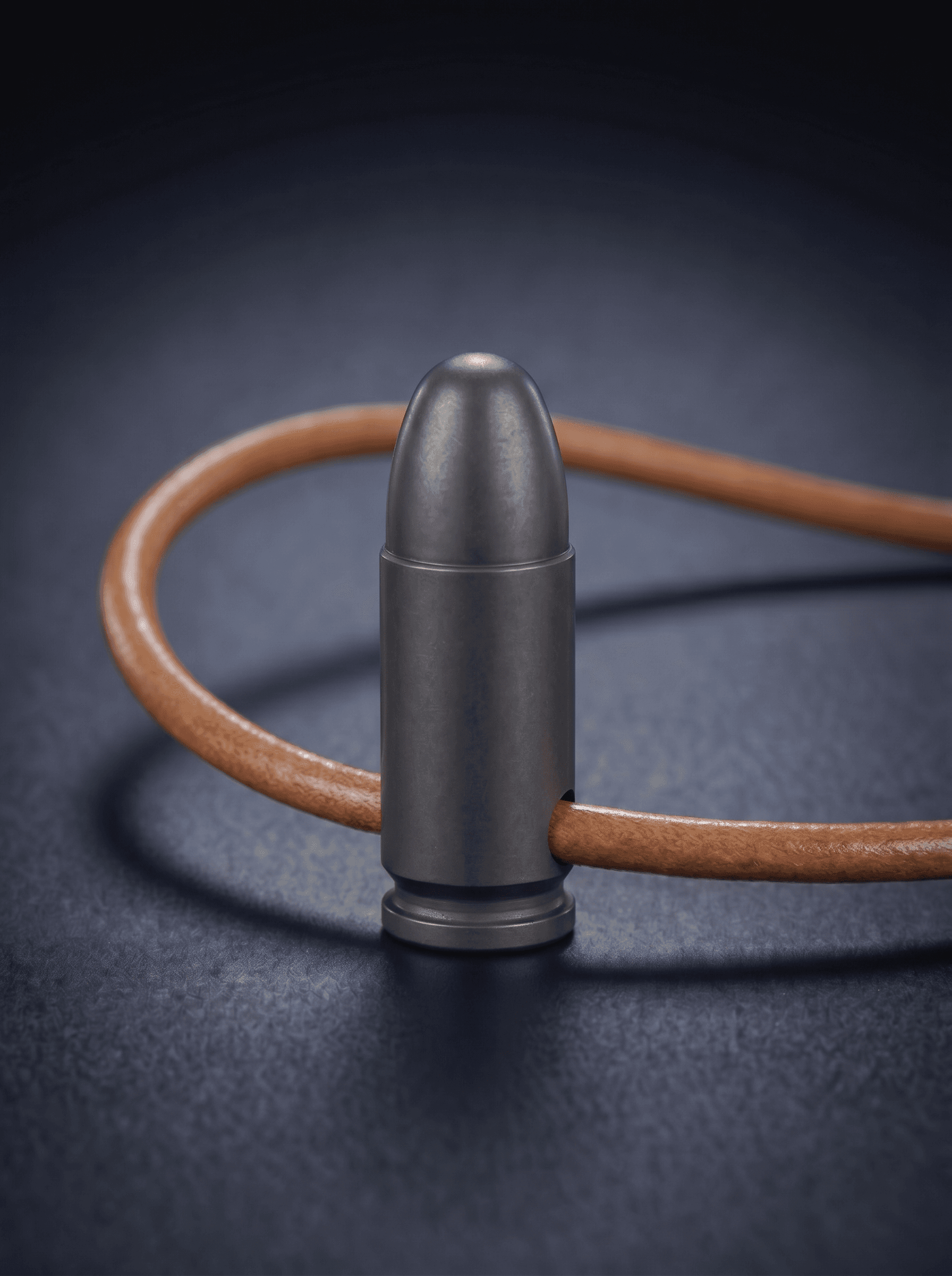 Pistol Cartridge in black on original leather cord — view 1 — Wear Metal