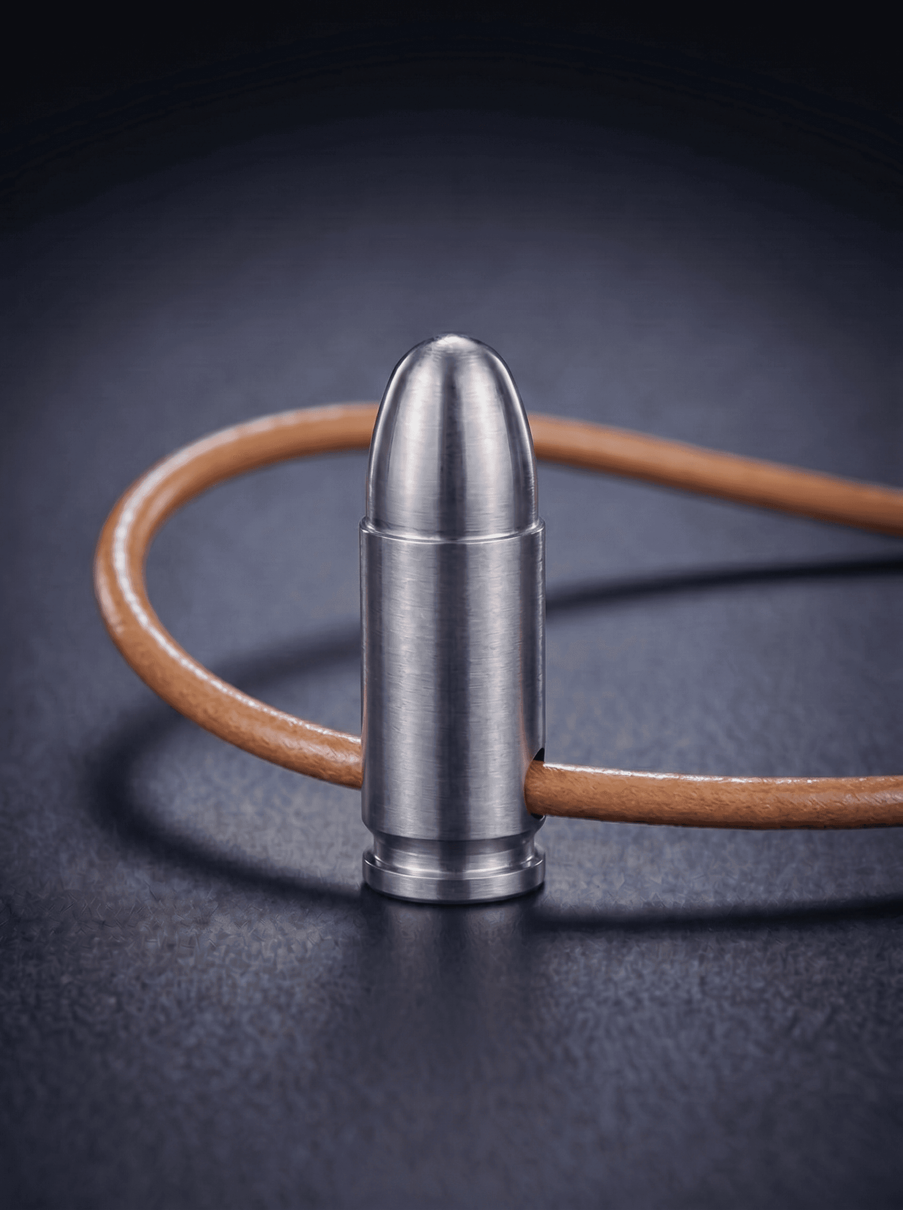 Pistol Cartridge in natural titanium on original leather cord — view 1 — Wear Metal